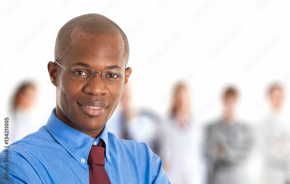 Black businessman in front of a group of people Black businessman in front of a group of people