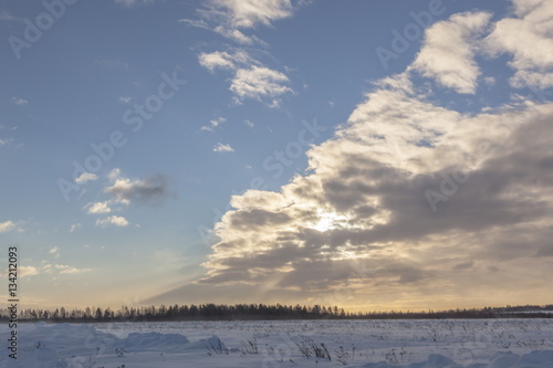 Sky and clouds over a snowy field