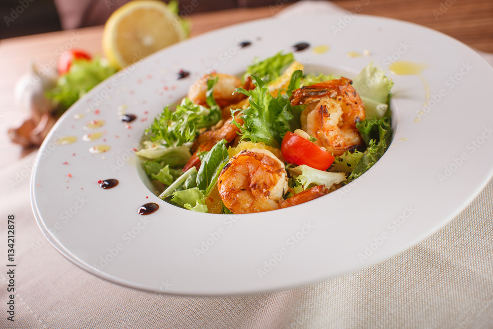 Caesar salad with shrimps and iceberg leaves Caesar salad with shrimps and iceberg leaves