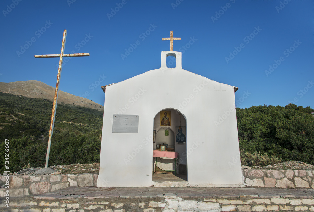 Fototapeta premium Small church with blue roof on a Albanian beach