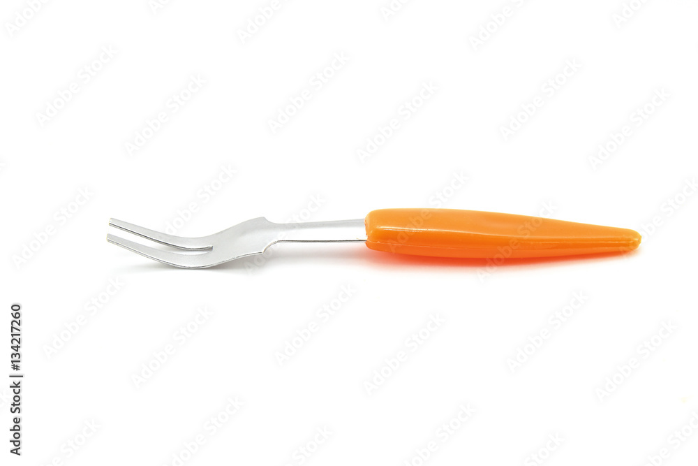 Small fork for fruit on white background Small fork for fruit on white background