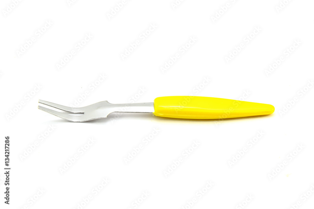 Small fork for fruit on white background Small fork for fruit on white background