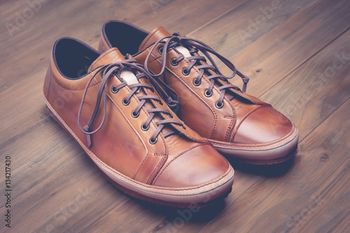 A pair of brown leather shoes with vintage