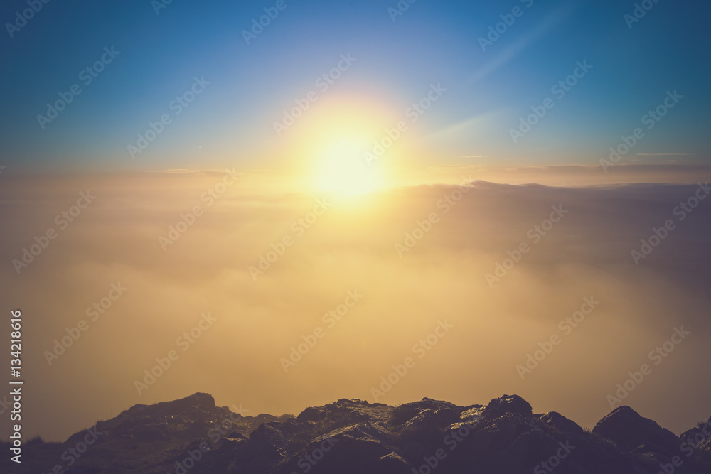 Obraz premium Bright Sun Above Clouds Seeing from the Top of Mountain
