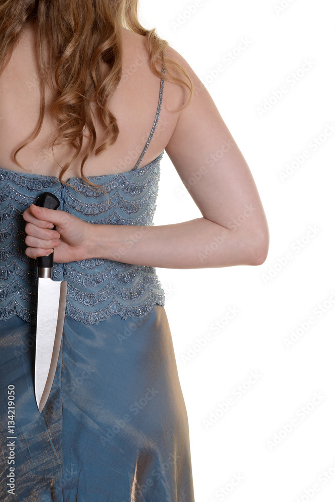 closeup woman with knife behind her back Stock Photo Adobe Stock