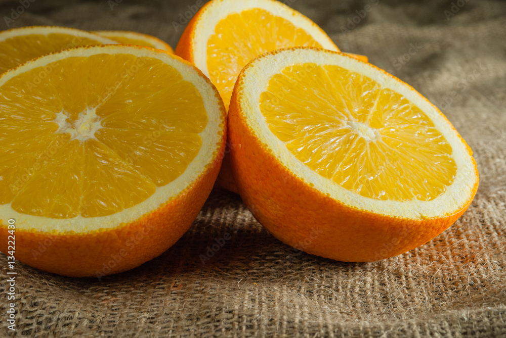 Oranges Fruits and Orange Slice on Wooden Table and Retro Fabric Oranges Fruits and Orange Slice on Wooden Table and Retro Fabric