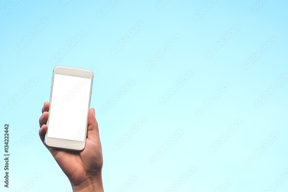 Mockup image of hand holding white mobile phone with blank white screen ...