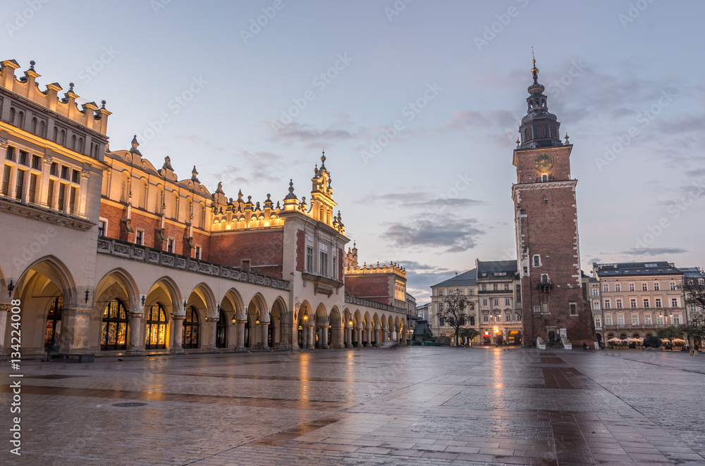 Cloth Hall and Town Hall tower on the Main Market Square in Krakow, Poland, illuminated in the morning