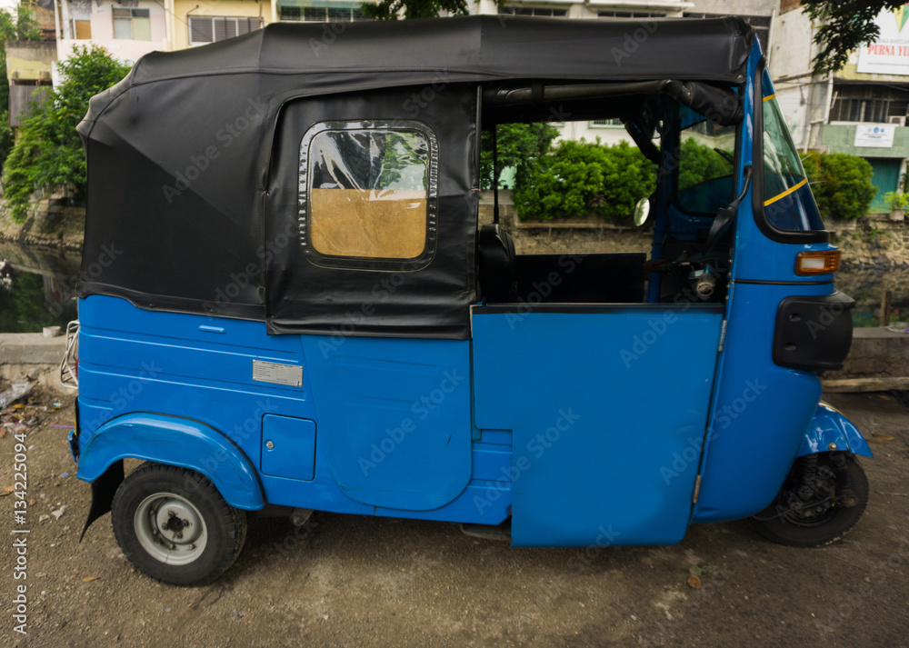 Blue Tricycle in Indonesia known as Bajaj photo taken in Jakarta Indonesia