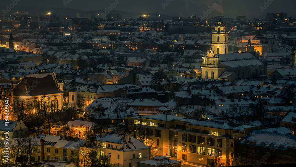 Night panorama of the Vilnius Old Town from the Hill of Three Crosses, Lithuania. Vilnius winter aerial panorama of Old town. Aerial panorama of the Vilnius Old Town at dusk time.