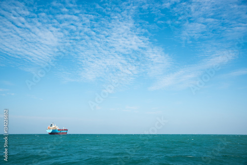 one ship in the blue sea under blue sky