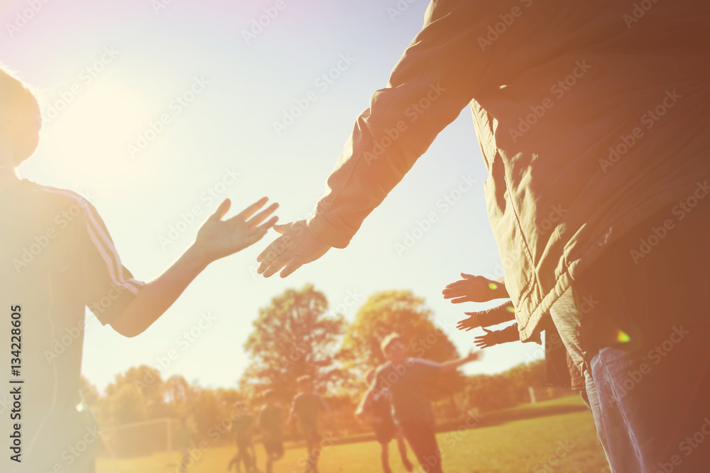 Fototapeta premium High Five line after a childs soccer game. Instagram effect