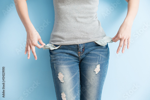 woman showing her empty pockets