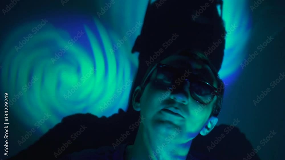 Man in sunglasses in the spotlight Man in sunglasses in the spotlight