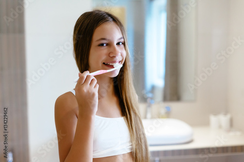 Pre teen girl in the hotel bathroom