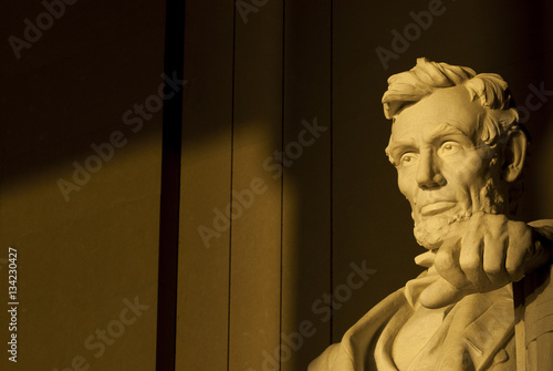 Statue of Abraham Lincoln in brilliant warm dramatic morning sunlight