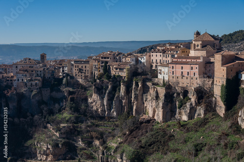 View to hanging houses "casas colgadas" of Cuenca old town.Example of a medieval city, built on the steep sides of a mountain. Many casas colgadas are built right up to the cliff edge. Cuenca, Spain