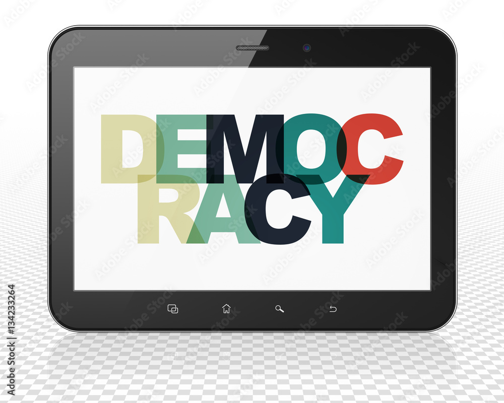 Political concept: Tablet Pc Computer with Democracy on display Political concept: Tablet Pc Computer with Democracy on display