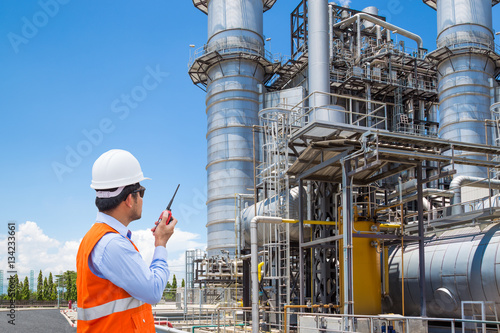 Bild auf Leinwand Engineer working at thermal power plant with talking on the radio
