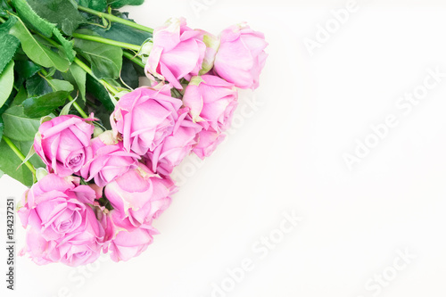 Valentines day violet fresh roses vouquet on beige background