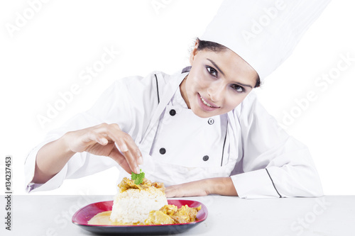 Obraz na plátně Indian chef with food in the studio