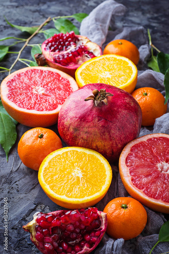 Dissected fresh fruits. Pomegranate  orange  grapefruit and tang