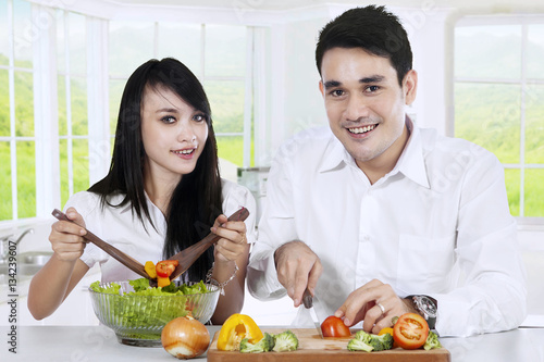 Vegetarian couple preparing healthy food
