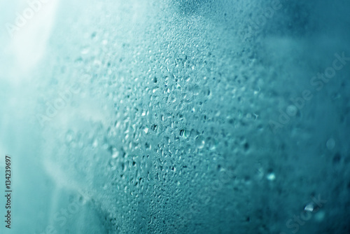 Drops of water on wet window.