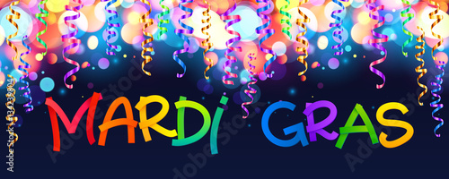 Colorful Mardi Gras sign on dark blue background with bokeh and confetti