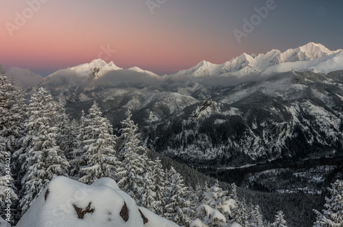 Winter Tatra mountains, Lodowy Szczyt (Ice Peak) and Hawran over Rybiego Potoku Valley in High Tatra mountain range photo