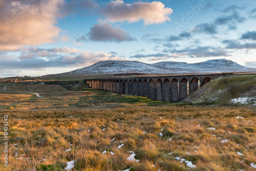 Ribblehead Viaduct (also known as Batty Moss Viaduct) in the autumn evening light in the Yorkshire Dales. The viaduct carries the Settle-Carlisle railway being built by Midland railway 1870-1874.