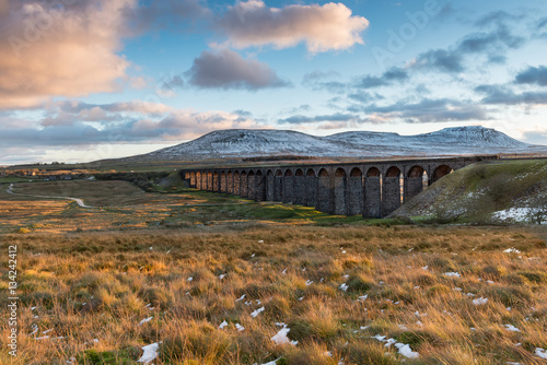 Ribblehead Viaduct (also known as Batty Moss Viaduct) in the autumn evening light in the Yorkshire Dales. The viaduct carries the Settle-Carlisle railway being built by Midland railway 1870-1874. photo