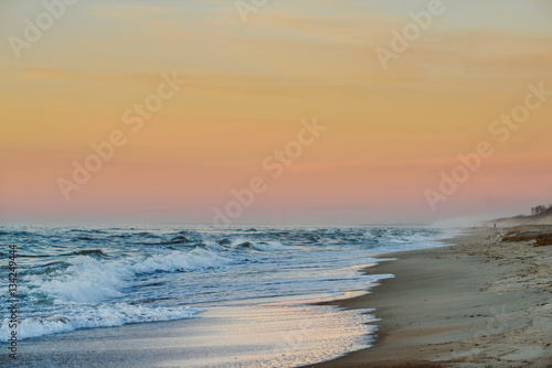 Sunset in the empty beach in Curonian Spit, Neringa, Lithuania