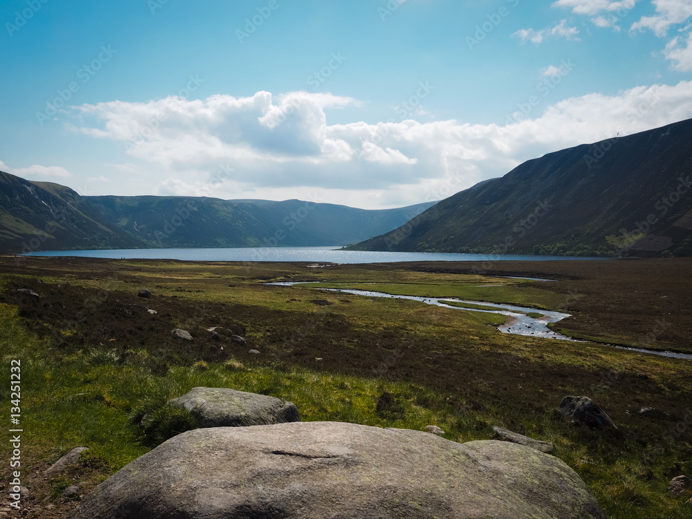 View to Loch Muick with large boulder in foreground - Glen Muick, Scotland