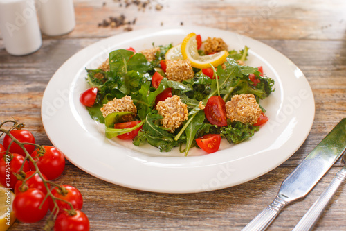 salad of arugula with cherry tomatoes and croutons