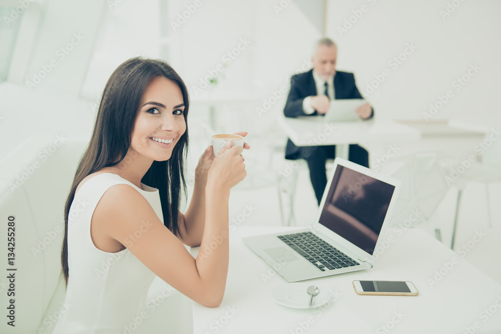 Portrait of happy cheerful secretary having break and drinking c Portrait of happy cheerful secretary having break and drinking c
