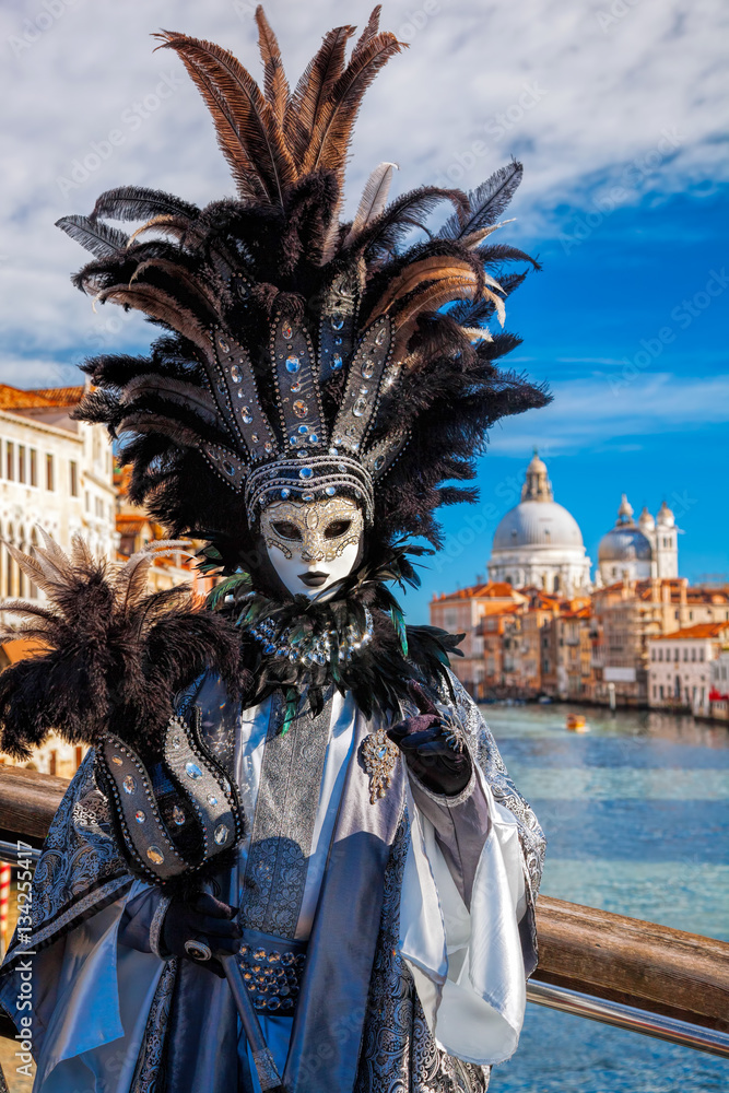 Fototapeta premium Carnival mask against Basilica di Santa Maria della Salute in Venice, Italy