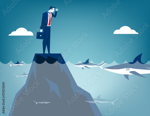 Businessman surrounded by shark
