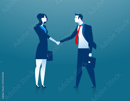 Businesswoman and businessman shaking hands