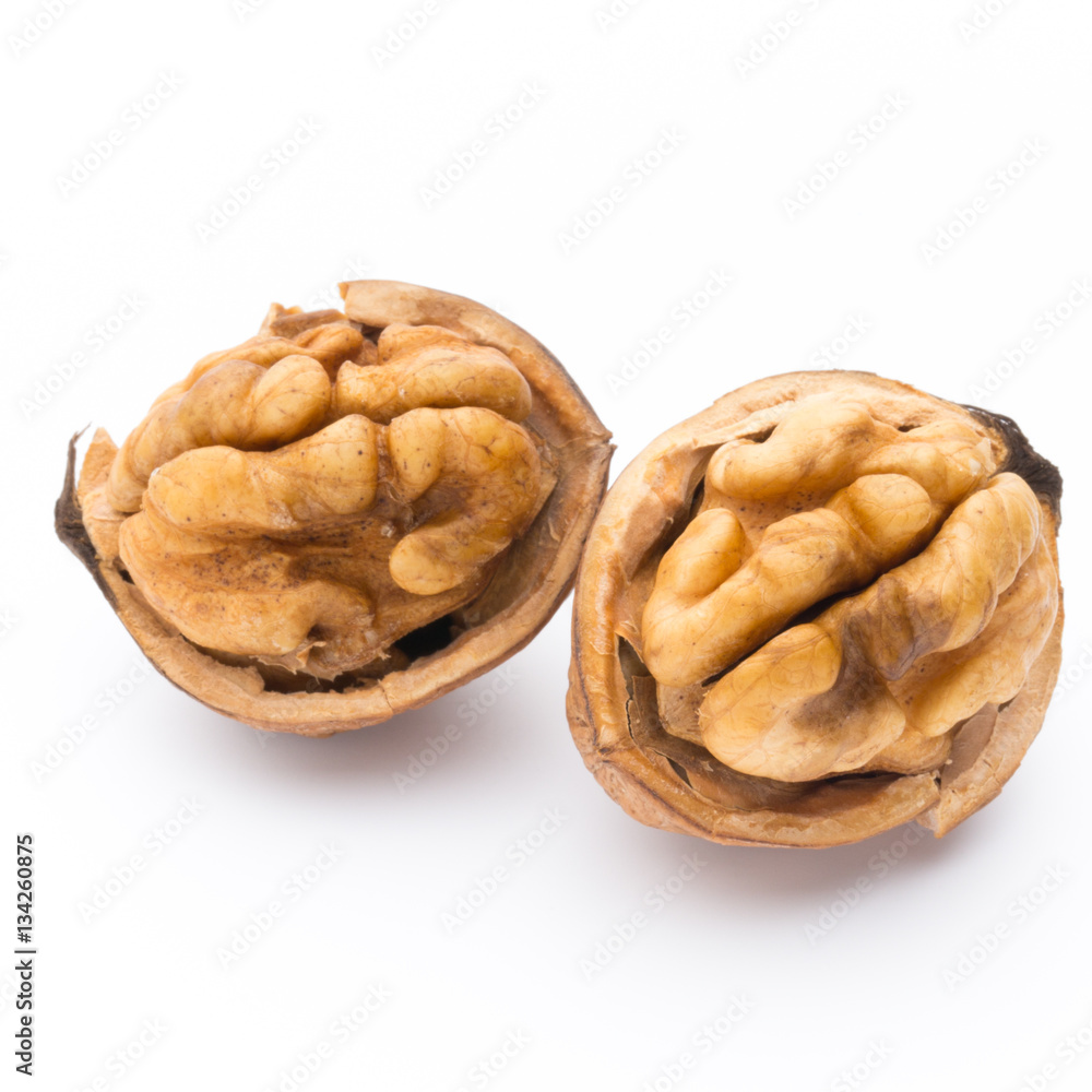 Walnut and walnut kernel isolated on the white background. Walnut and walnut kernel isolated on the white background.