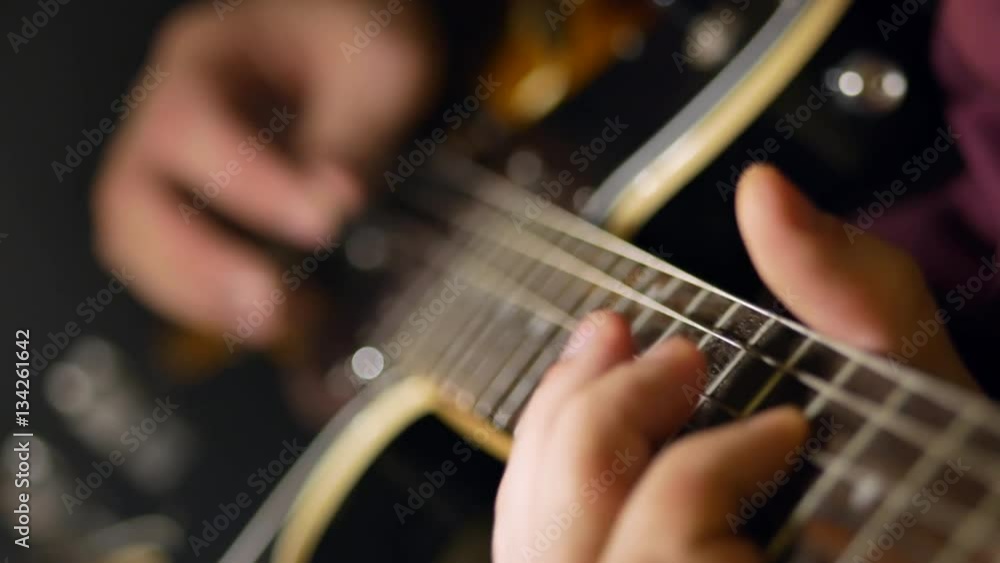 A man plays the guitar. Close-up A man plays the guitar. Close-up