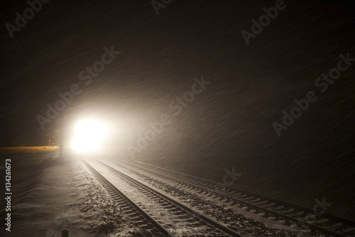 headlights of train in winter night