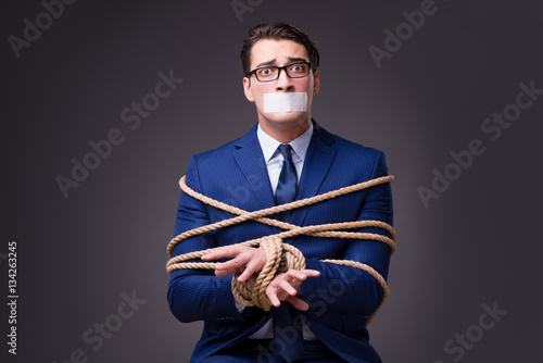 Photos Businessman taken hostage and tied up with rope