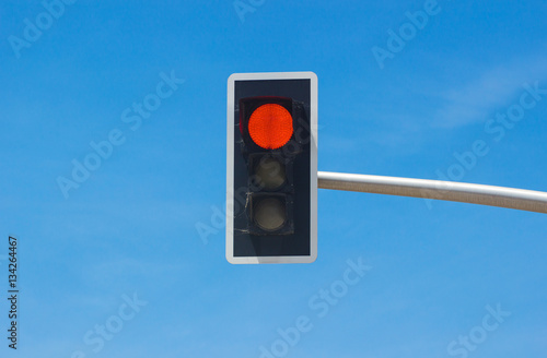 Traffic lights over blue sky background. Red