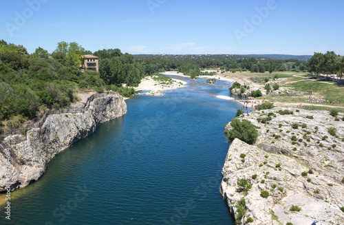 Gardon river in nature by the Pont du Gard aqueduct in southern France.