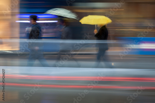 Photography Busy downtown scene in the rain with blurred motion