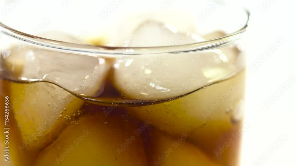 tasty cola and ice in glass