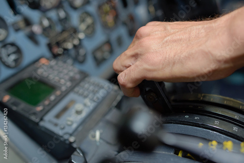 Closeup of hand on aircraft controls