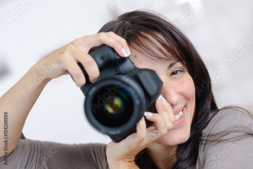 Woman holding an expensive camera