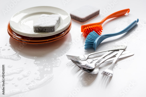 concept of washing dishes on white background